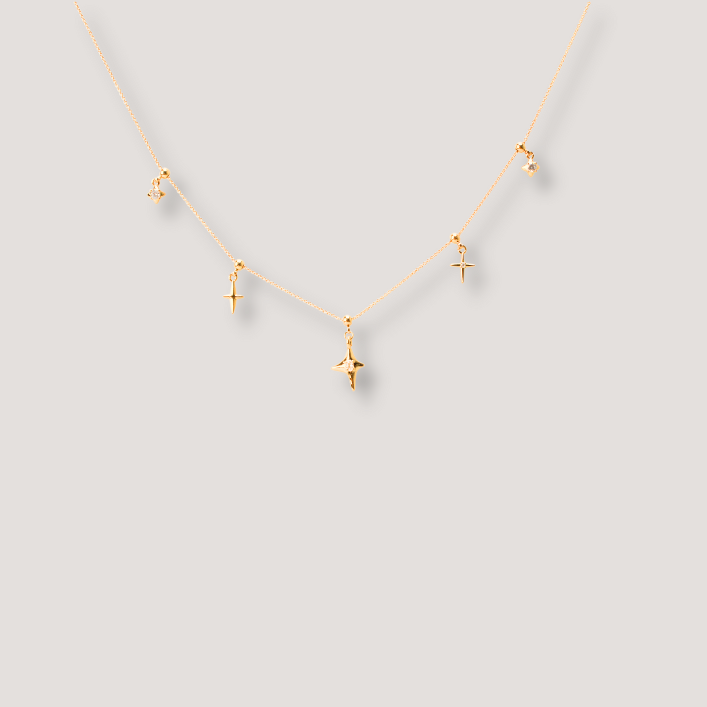 Gold Star Charm Necklace with Crystal Accents